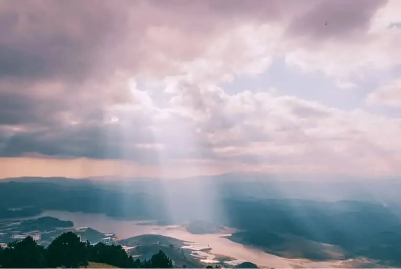 an image of a sunset shining the clouds featured image for Homesick For Heaven? 8 Important Verses Of Hope