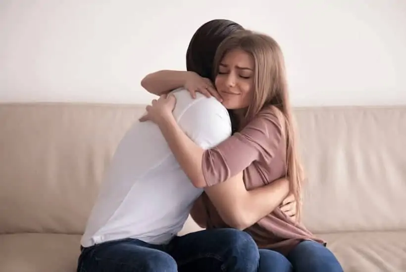 an image of man and woman holding onto one another sitting on a couch title reading Forgive Like Jesus: The Power of Forgiveness
